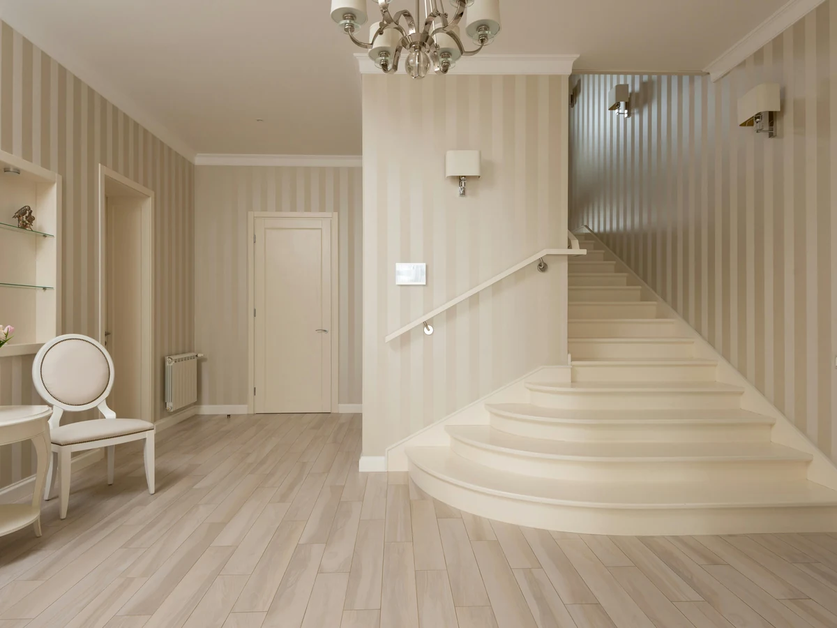 Bedroom feature wall with floral wallpaper in Cheltenham, painted by Cheltenham Decorators