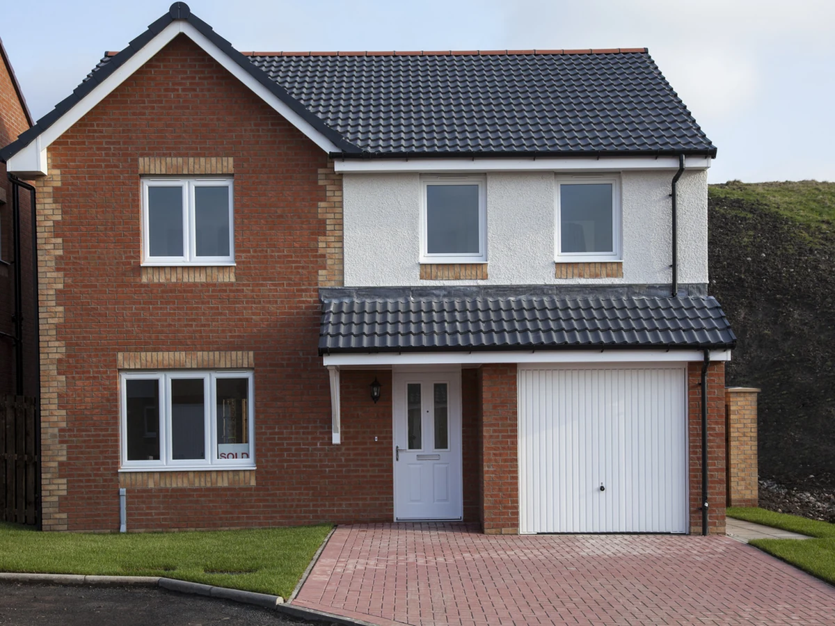 Exterior painting on a brick detached house in Cheltenham by Cheltenham Decorators