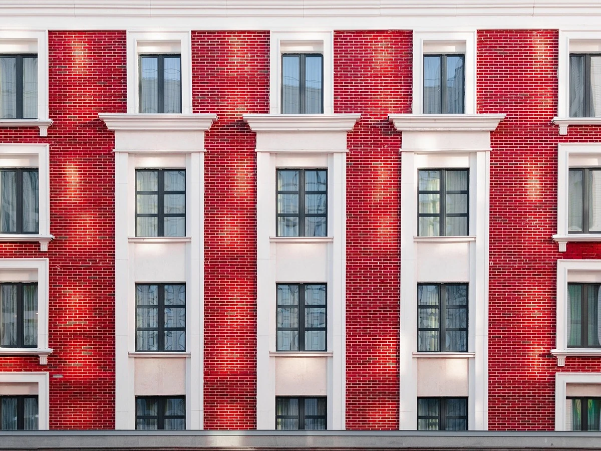 Red brick building exterior painting by Cheltenham Decorators in Tewkesbury