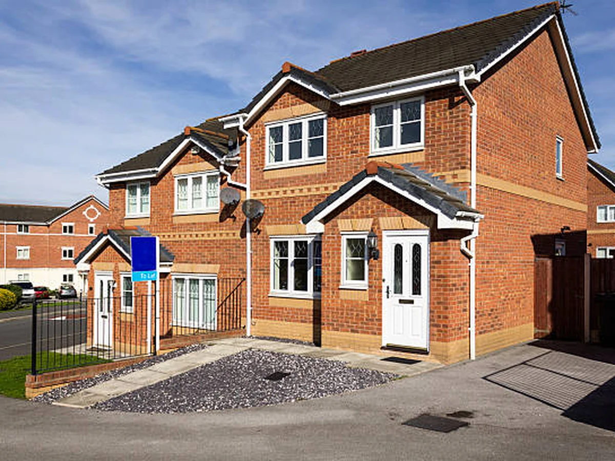 Red brick semidetached house painting in Charlton Kings, Cheltenham Decorators