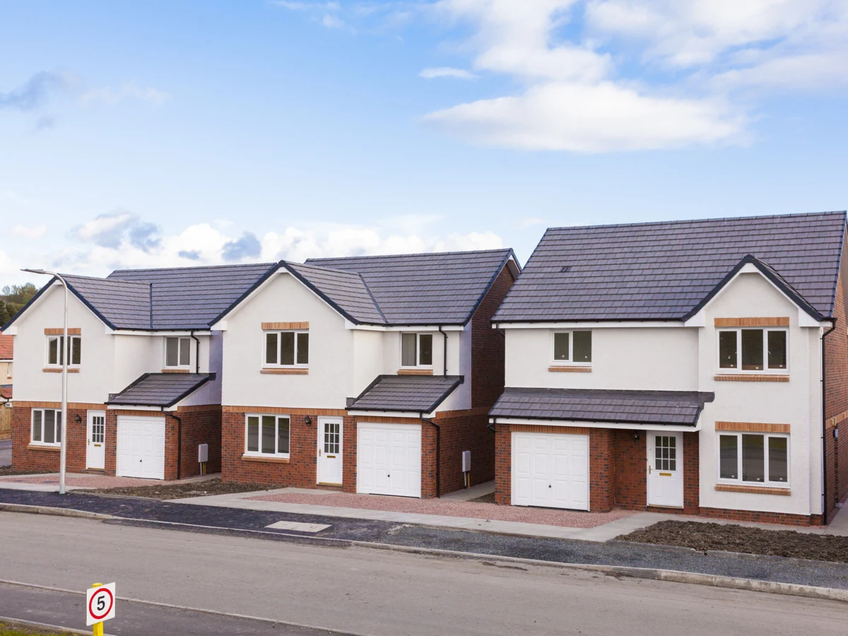 Exterior painting on detached homes in Swindon Village by Cheltenham Decorators