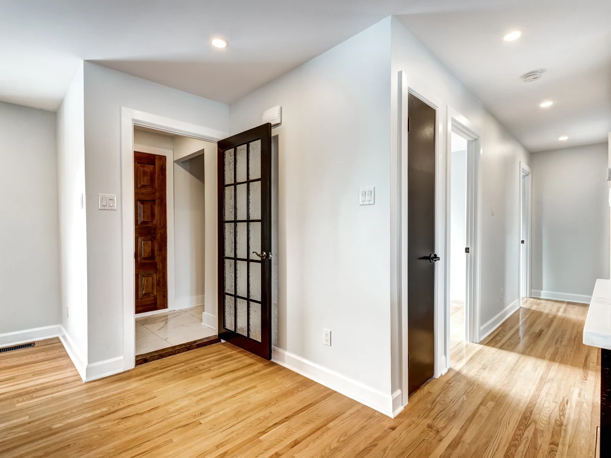 Clean white hallway painting by Cheltenham Decorators in Tewkesbury period property
