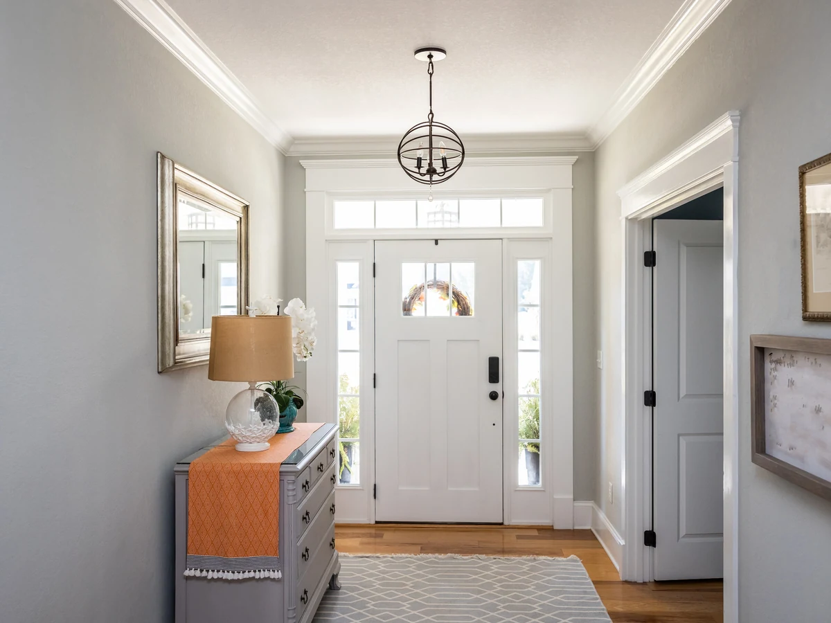 Grey entrance hallway painting in Cheltenham, scuff-resistant finish by Cheltenham Decorators