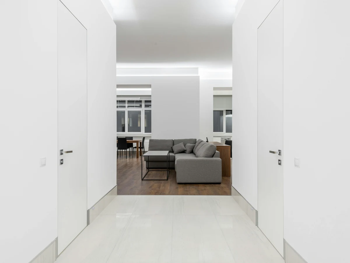 Freshly painted minimalist white hallway corridor in a Warden Hill home by Cheltenham Decorators