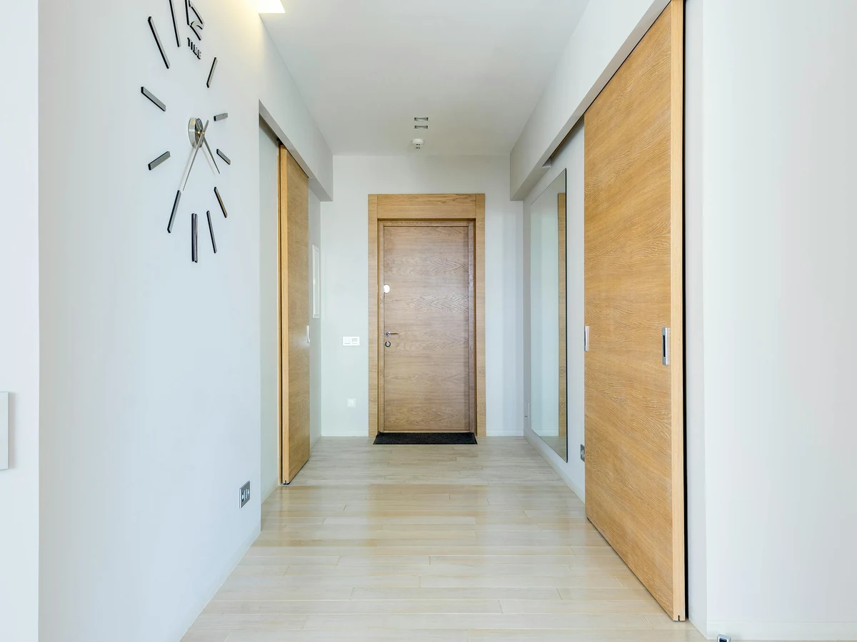 Hallway painting with white walls and wood detail in Up Hatherley by Cheltenham Decorators