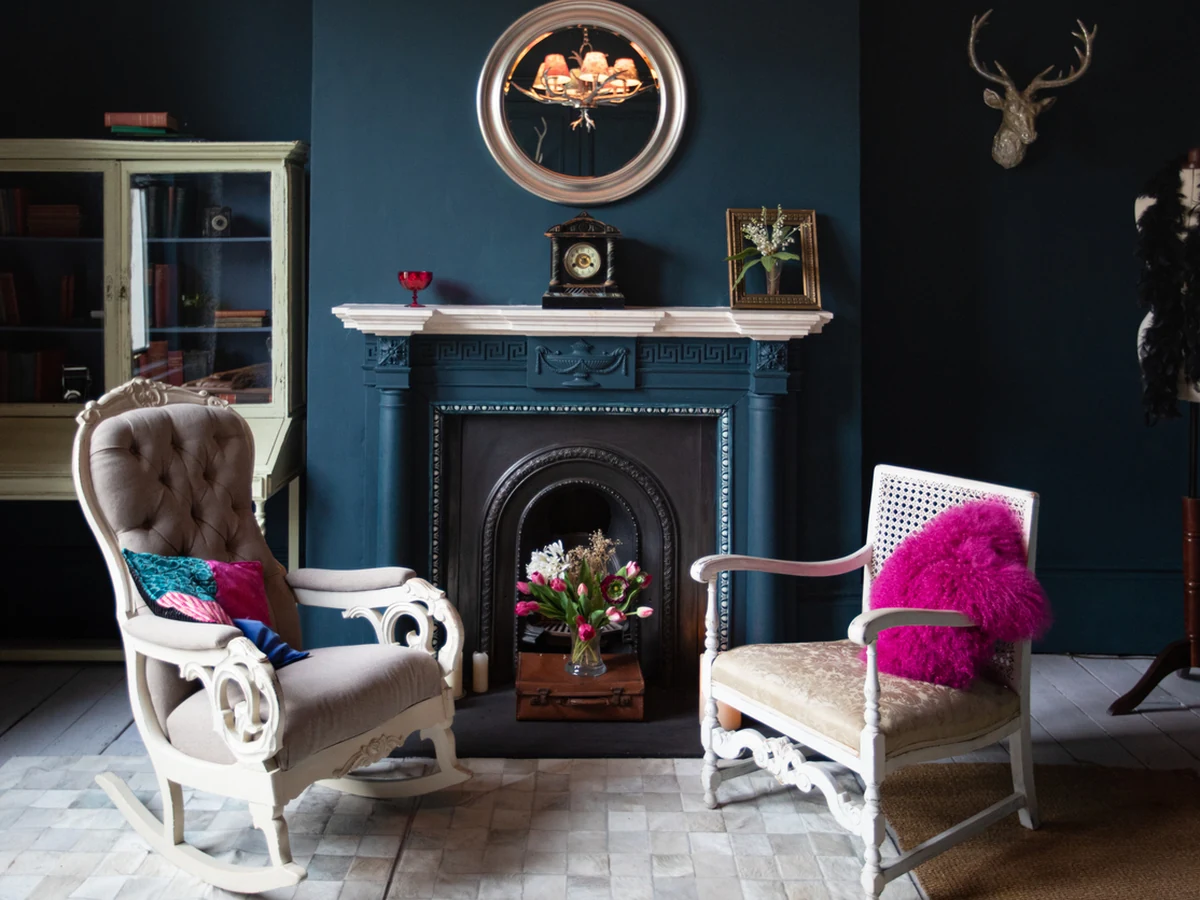 Living room painted in dramatic dark teal in Up Hatherley by Cheltenham Decorators