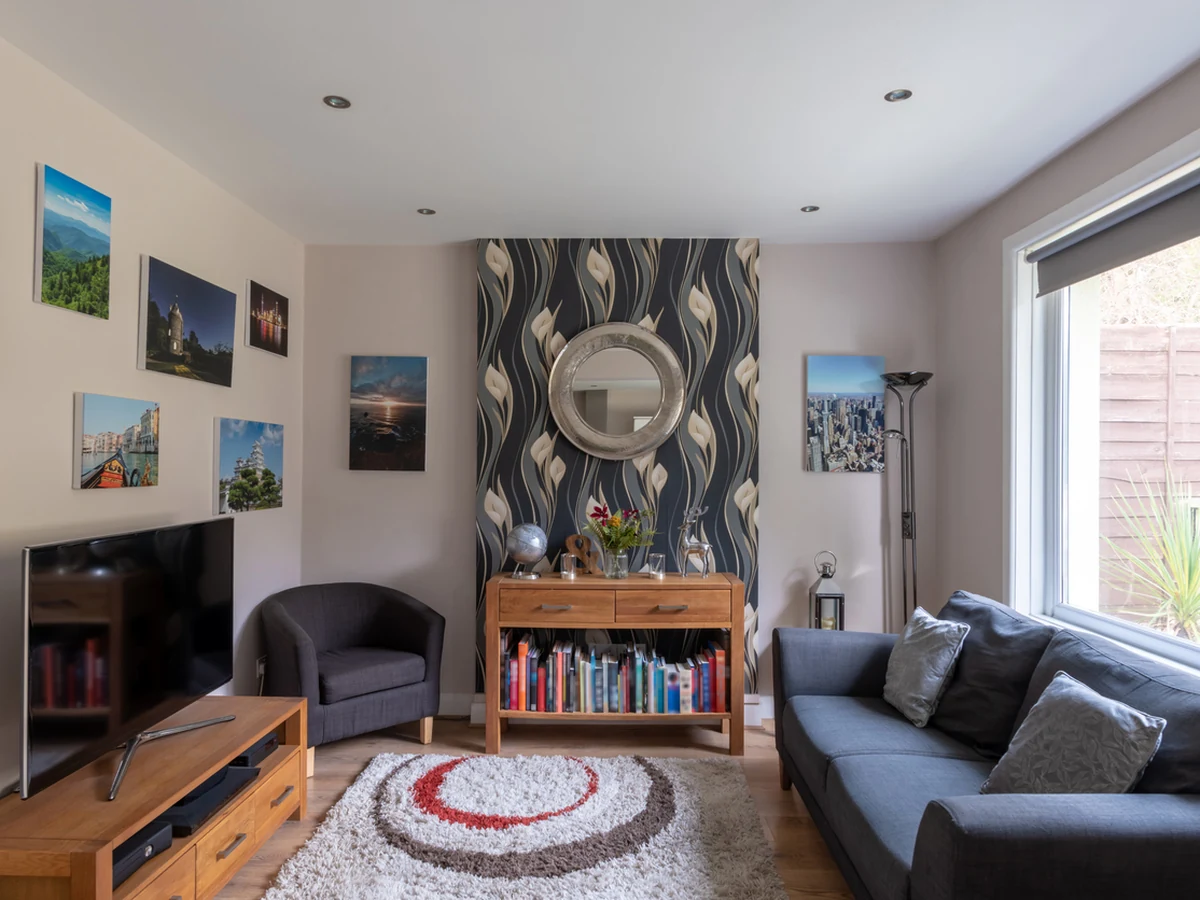 Lounge with feature wallpaper wall in Cheltenham, decorative interior finish