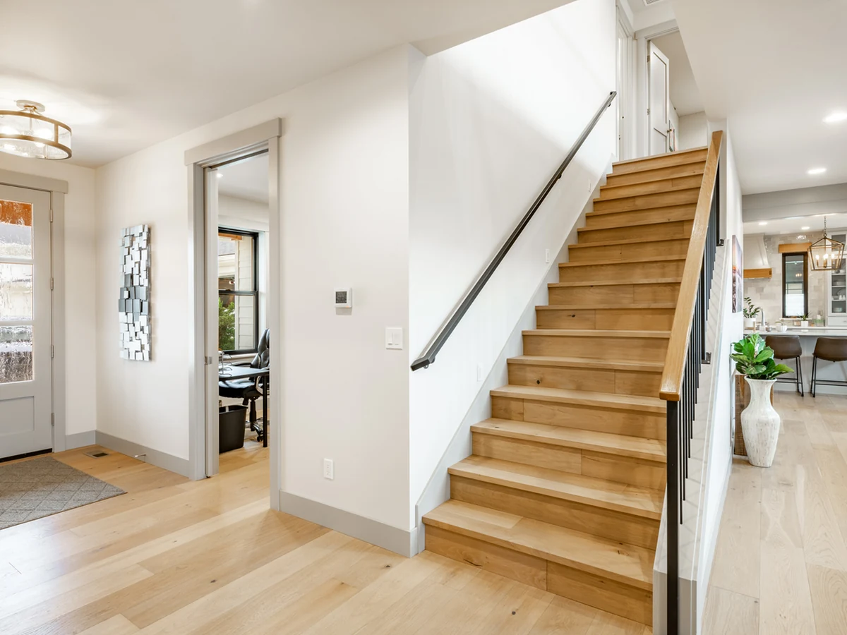 Bright farmhouse hallway staircase painting in Cheltenham by Cheltenham Decorators