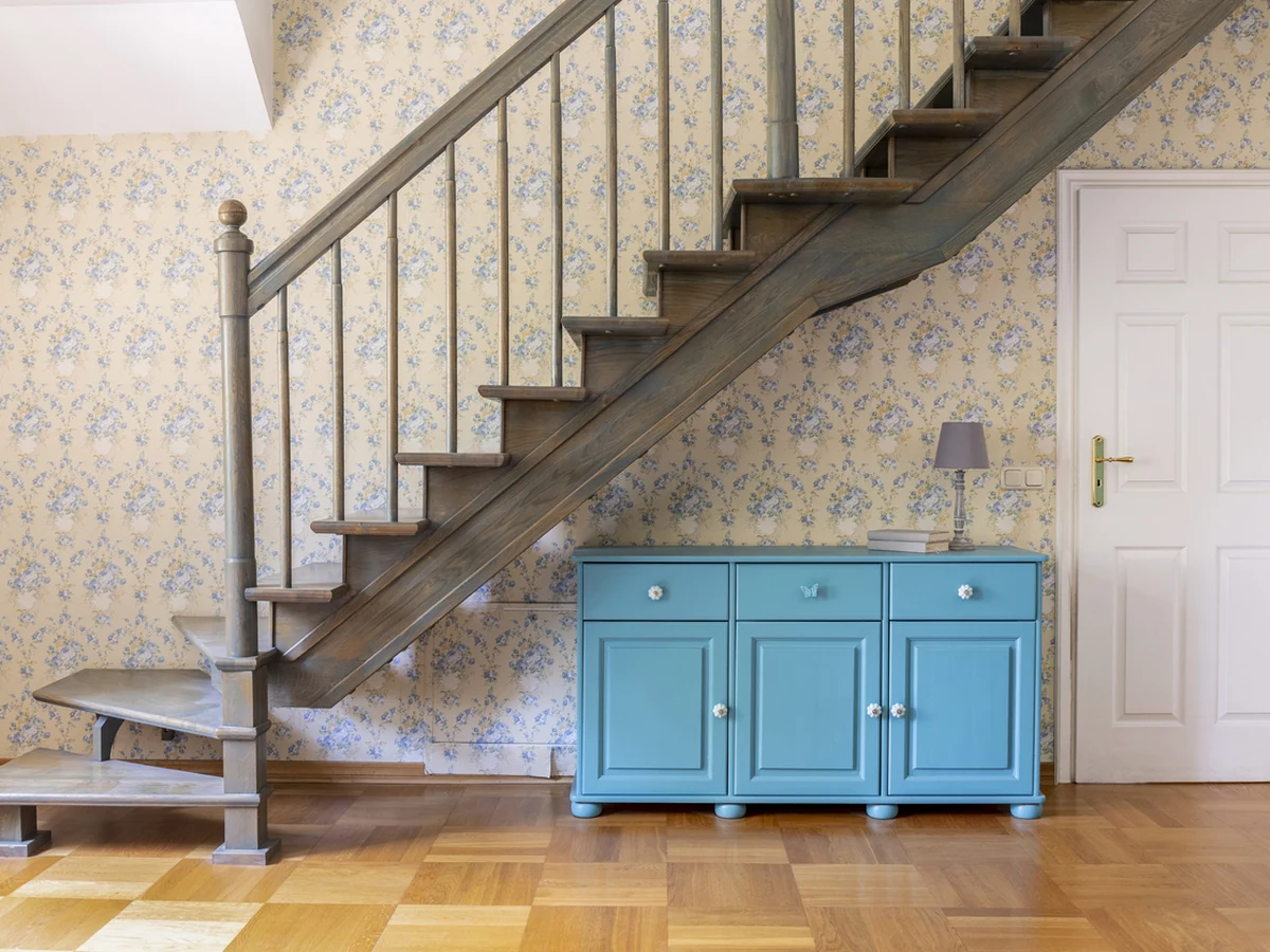 Staircase painting with floral wallpaper in period Cheltenham property by Cheltenham Decorators