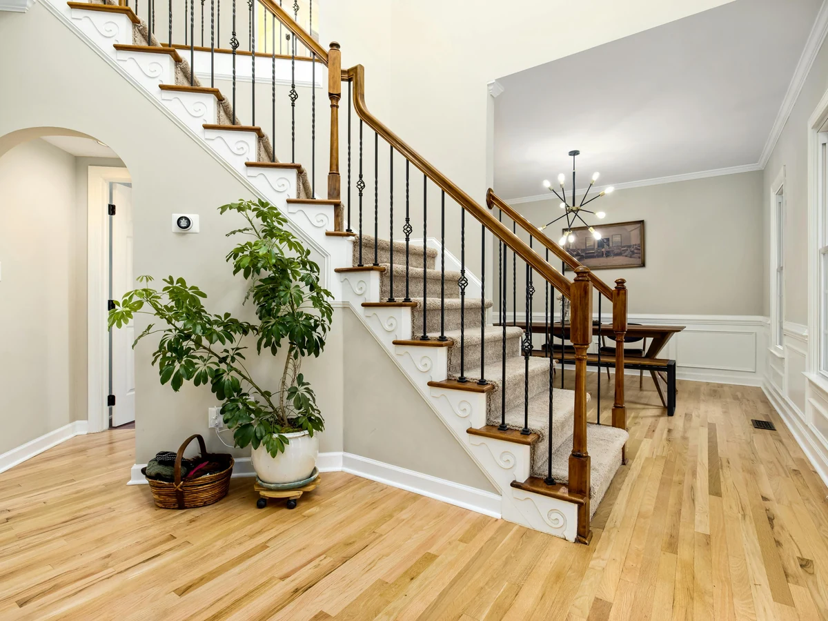 Traditional staircase painting with wood detail in Up Hatherley by Cheltenham Decorators