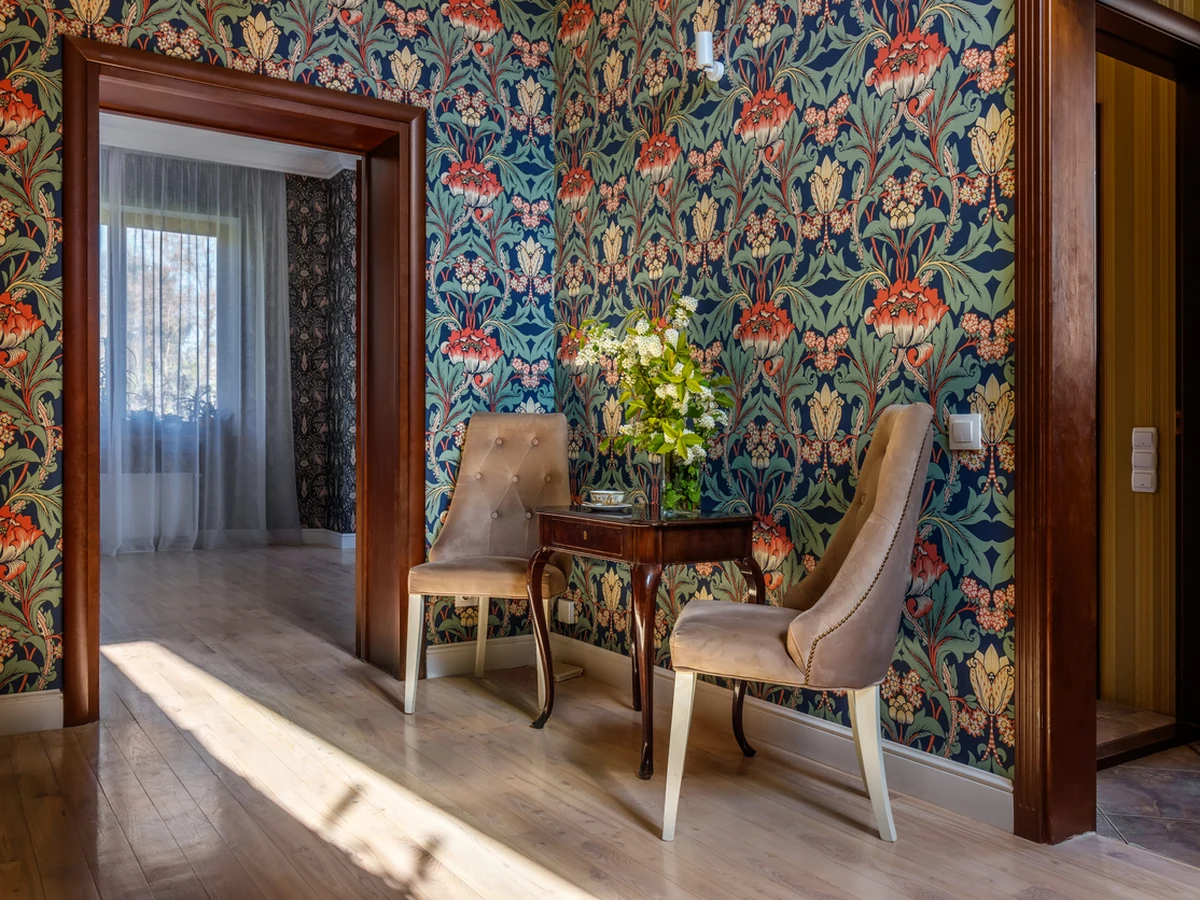 Ornate floral wallpaper hanging in Charlton Kings home by Cheltenham Decorators