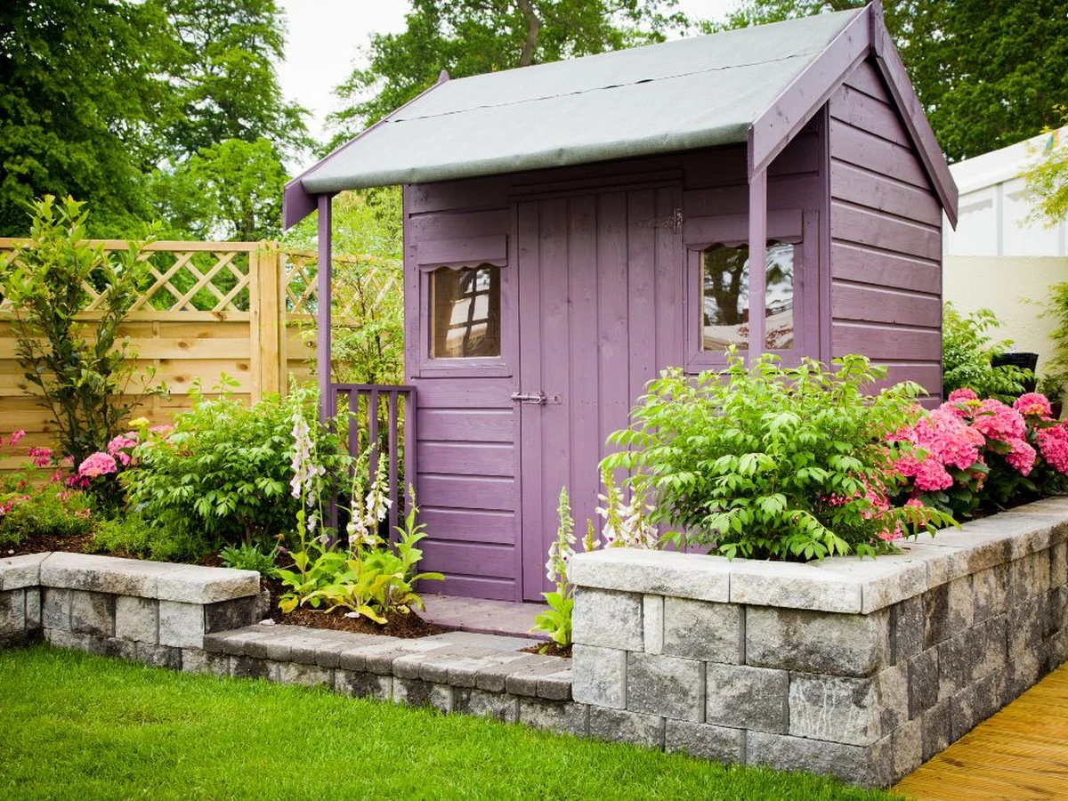 Purple wooden garden structure painted in Cheltenham, exterior timber treatment