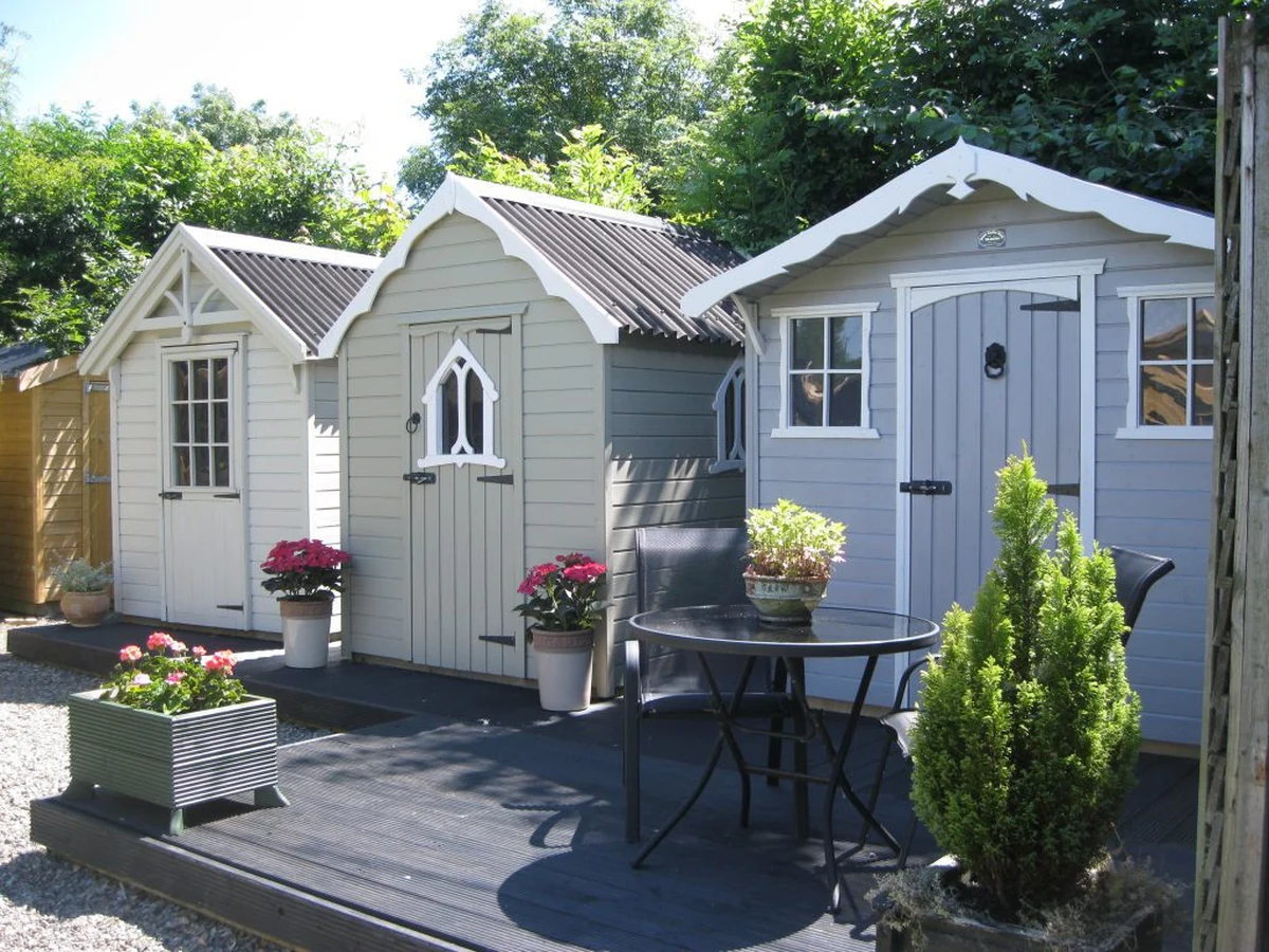 Two painted garden sheds in Cheltenham by Cheltenham Decorators
